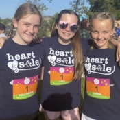 Three Heart & Sole participants smiling at 5K